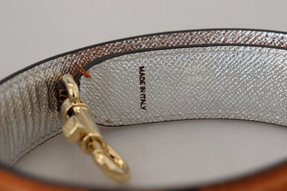 Schicker orangefarbener Taschengurt aus Leder mit goldfarbenen Verschlüssen