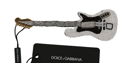 Goldfarbene Gitarrenbrosche mit Pailletten
