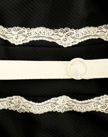 Elegantes Etuikleid aus Spitze in Schwarz und Beige