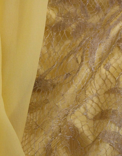 Gelbes Minikleid aus Spitze mit Kristallverzierung